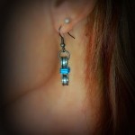 blue earrings on model